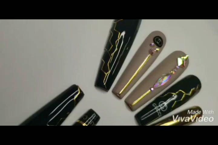 Elegant Black and Gold Nails