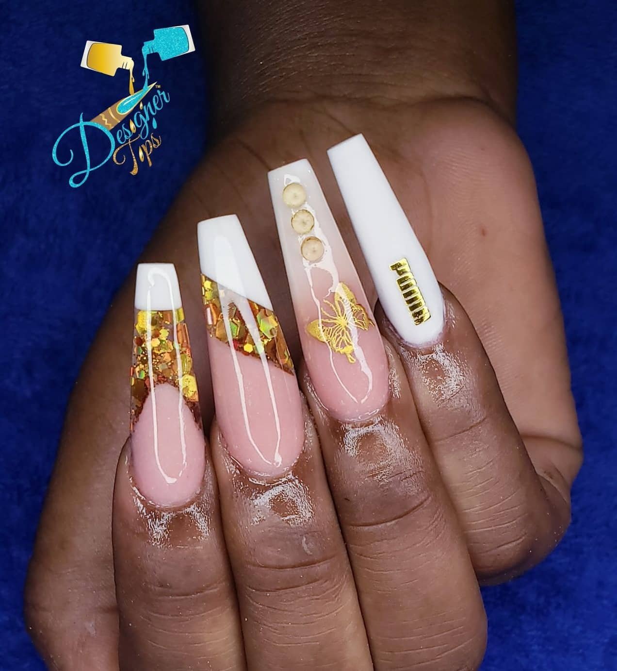 Artistic Nail Design with Gold Accents