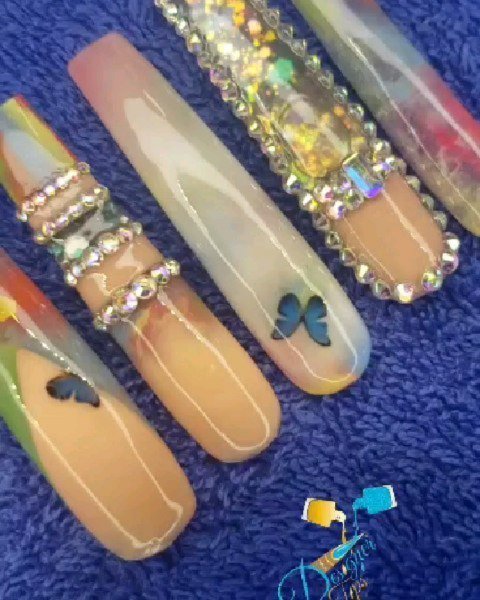 Colorful Artistic Nail Design with Butterflies