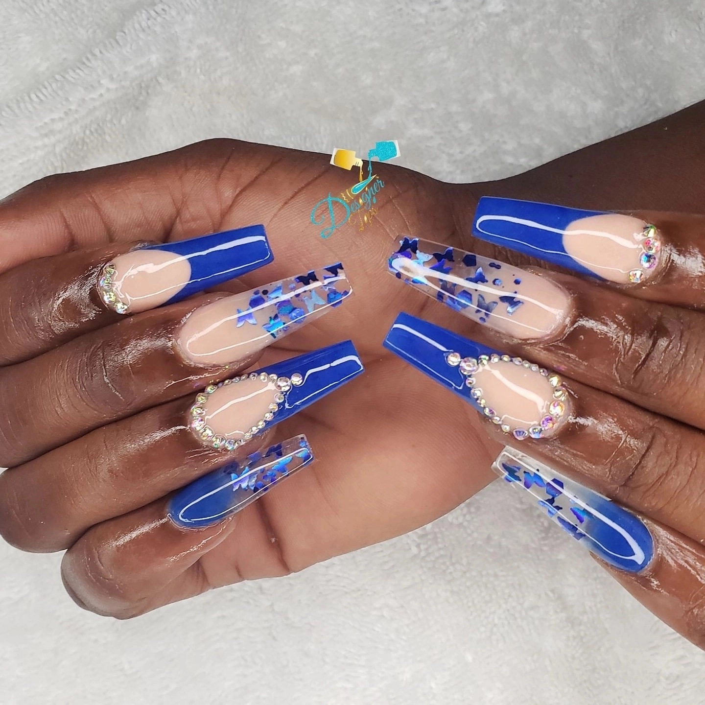 Elegant Blue and Nude Star-themed Nails