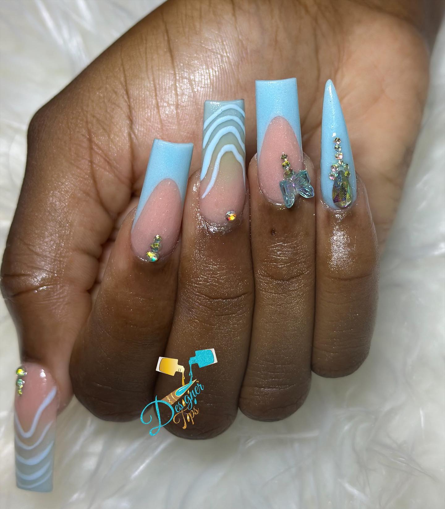 Artistic Blue and Nude Nails with Gems