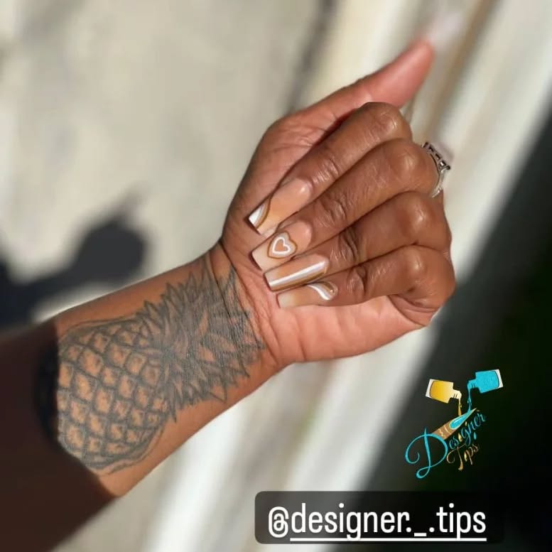 Elegant Nude Nails with Heart Design