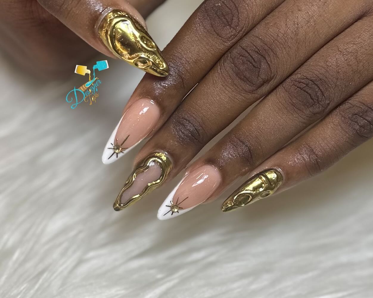 Artistic Gold and Nude Nail Design
