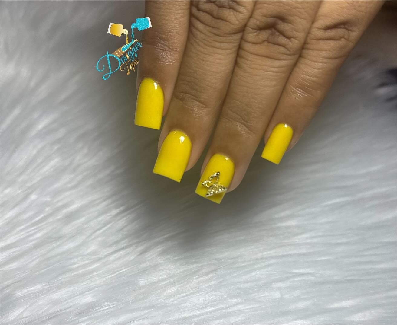 Bright Yellow Nails with Rhinestone Accent