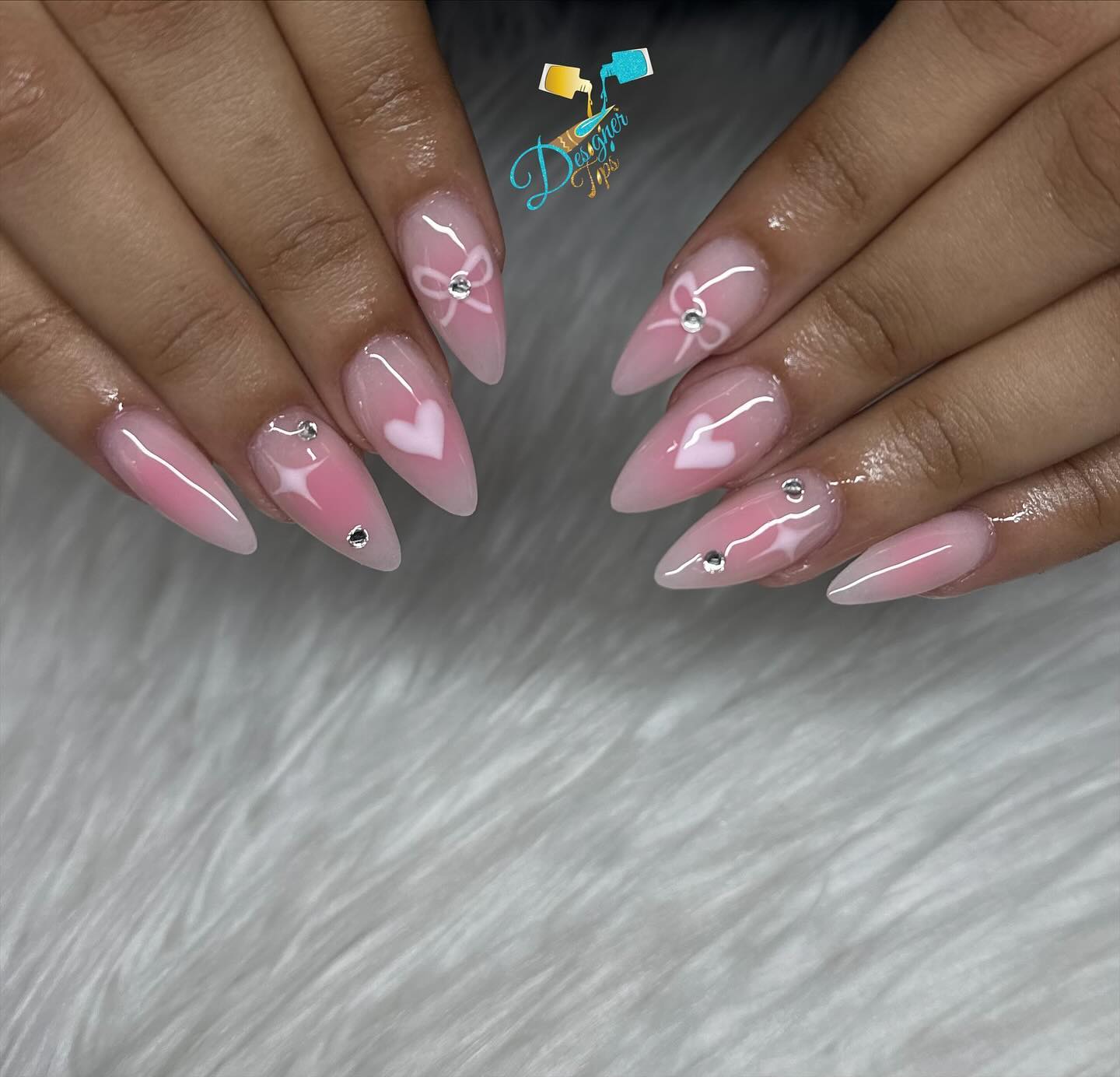 Elegant Pink Stiletto Nails with Heart Design