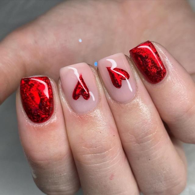 Stylish Red Nails with Heart Design
