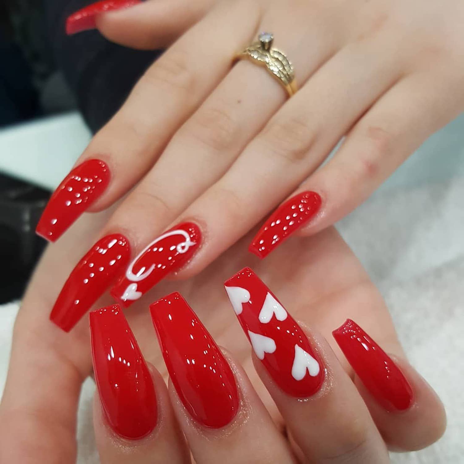 Elegant Red Nails with Heart Designs